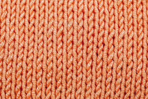 Knitted woolen texture background. Warm sweater, pullover pattern closeup Stock Photos