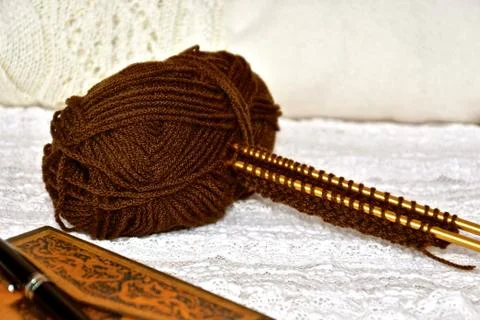 Knitting and journalling. Stock Photos