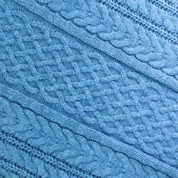 Knitting and needlework: patterned knitted fabric, short focus Stock Photos