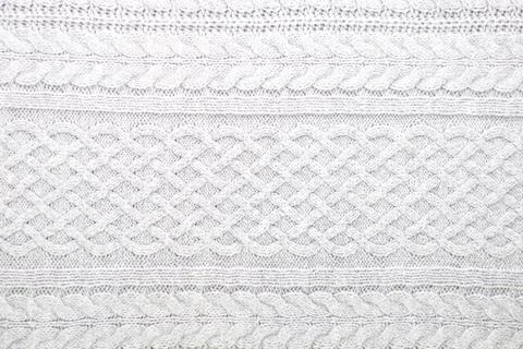 Knitting and needlework: patterned knitted fabric, short focus Stock Photos