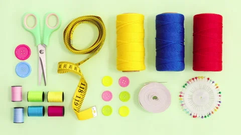 Knitting and sewing items move on green theme. Stop motion flat lay Stock Footage 154970917
