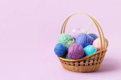 Knitting balls in basket Stock Photos