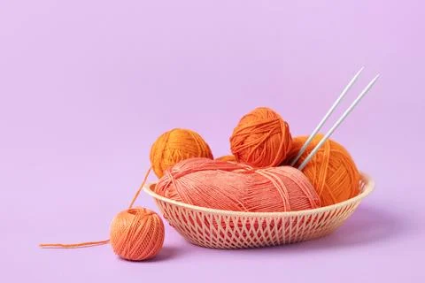 Knitting balls in basket Stock Photos