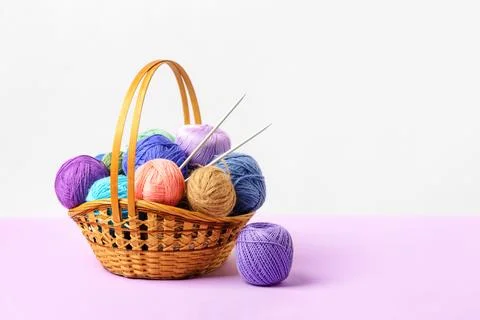 Knitting balls in basket Stock Photos