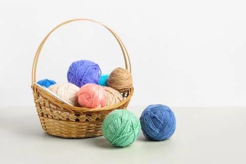 Knitting balls in basket Stock Photos