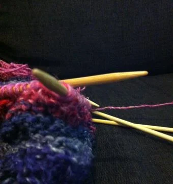 Knitting on black background Stock Photos
