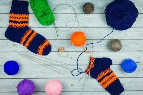 Knitting on blue background Stock Photos