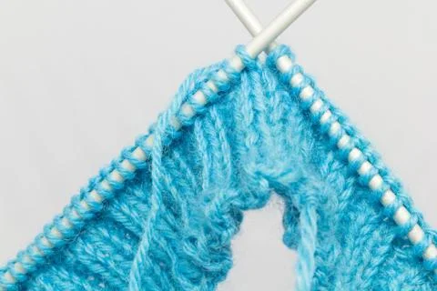 Knitting with a blue wool Stock Photos