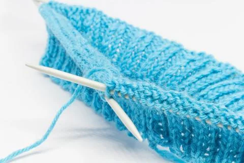 Knitting with a blue wool Stock Photos