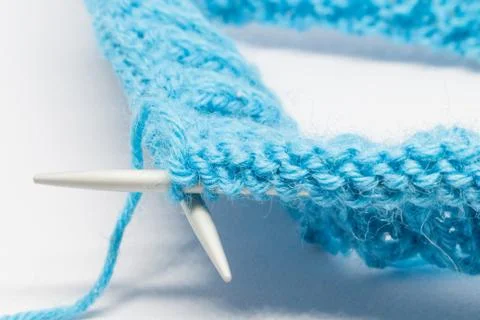 Knitting with a blue wool Stock Photos