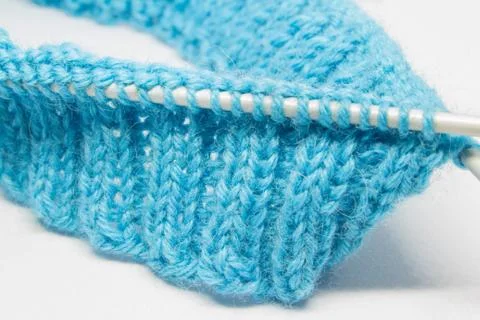 Knitting with a blue wool Stock Photos