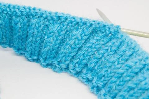 Knitting with a blue wool Stock Photos