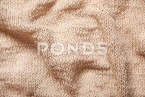Knitting Brown Or Beige Textured Wool Background, Close Up Of Wrinkled Fabric