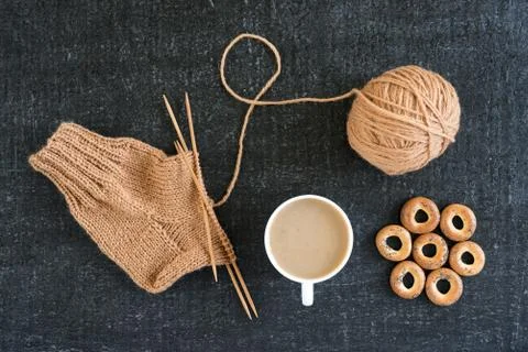 Knitting with coffee and ring-shaped cracknels Stock Photos
