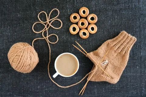 Knitting with coffee and ring-shaped cracknels Stock Photos