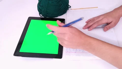 Knitting crochet hobby with tablet PC green screen. Green wool and woman hands Stock Footage 220764569