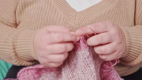 Knitting in female hands. handmade. close-up of female hands knitting on Stock Footage 219856280