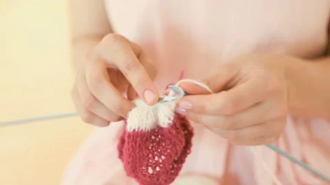 Knitting hand made hobby. Young woman hands with coll hipster tattoo working Stockbeeldmateriaal 88997712