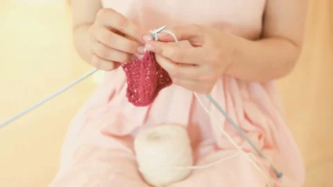 Knitting hand made hobby. Young woman hands with coll hipster tattoo working Stockbeeldmateriaal 88997713