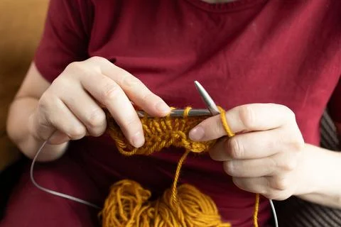 Knitting instead of scrolling during leisure time Stock Photos
