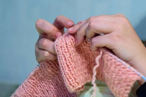 Knitting with knitting needles. The sight of a woman's hands knitting a pin.. Stock Photos