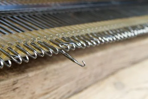 Knitting machine for knitting at home. one hook extended. Stock Photos