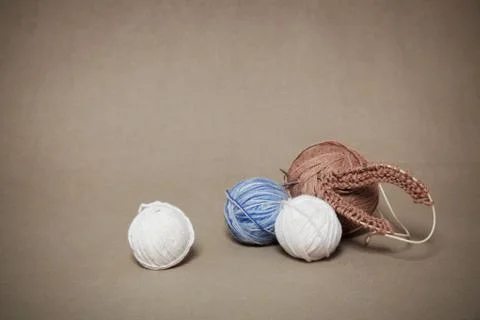 Knitting needles and balls of threads Stock Photos
