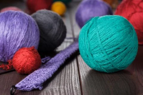 Knitting needles and balls of threads Stock Photos