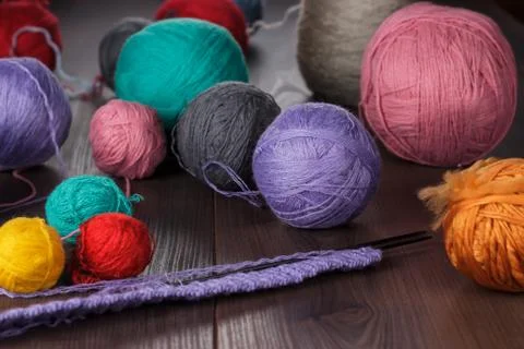 Knitting needles and balls of threads Stock Photos