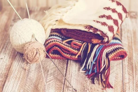 Knitting needles and yarn on rustic wooden background Stock Photos