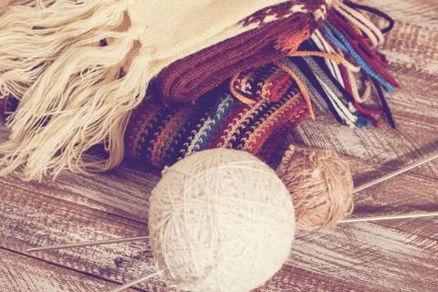 Knitting needles and yarn on rustic wooden background Stock Photos