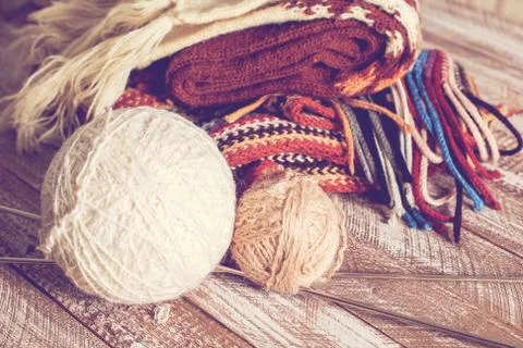Knitting needles and yarn on rustic wooden background Stock Photos
