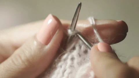 Knitting with needles during rest Stock Footage 89067623