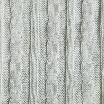 Knitting with needles. a pattern of braids of thread. background for the design. 写真素材