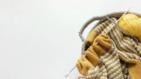 Knitting needles wool basket with copy space Stock Photos