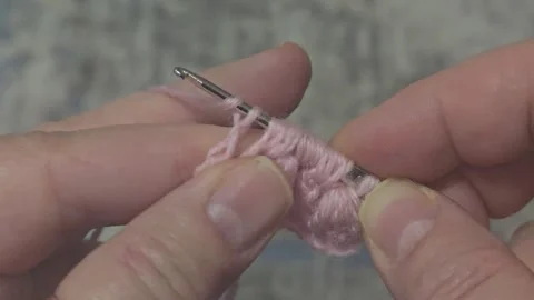 Knitting patterns and details for sweaters, hats, and other items, crocheted Stock Footage 323500825