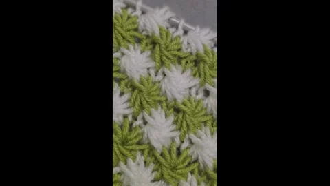 Knitting patterns and details for sweaters, hats, and other crocheted items. Video stock 326420076