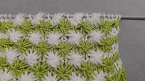 Knitting patterns and details for sweaters, hats, and other crocheted items. Video stock 326420285
