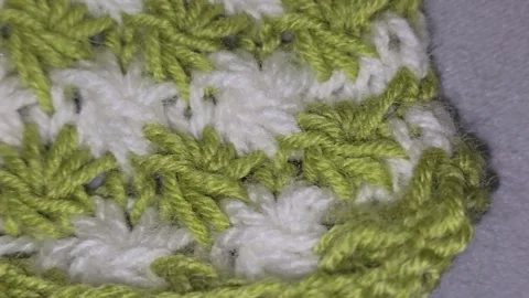 Knitting patterns and details for sweaters, hats, and other crocheted items. Video stock 326420467