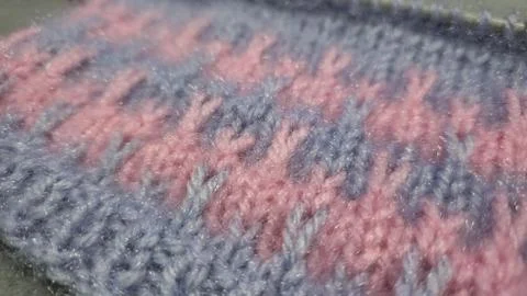 Knitting patterns and details for sweaters, hats, and other crocheted items. Foto stock