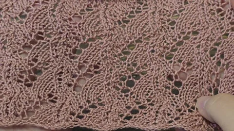 Knitting patterns with a raised pattern and yarn in different colors. texture. 動画素材 335865376