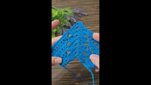 Knitting patterns with a raised pattern and yarn in different colors. texture. Stock Footage 335865498