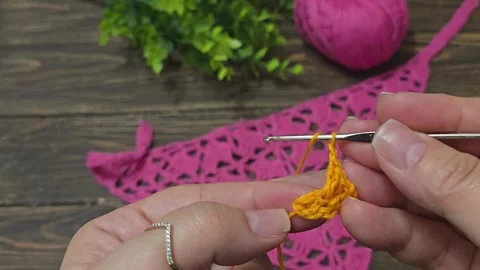 Knitting patterns with a raised pattern and yarn in different colors. texture. Stock Footage 335865714