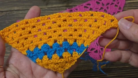 Knitting patterns with a raised pattern and yarn in different colors. texture. Stock Footage 335865753
