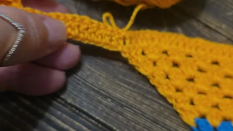 Knitting patterns with a raised pattern and yarn in different colors. texture. Stock Footage 335865799