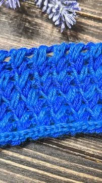 Knitting patterns with a raised pattern and yarn of different colors Stock Photos