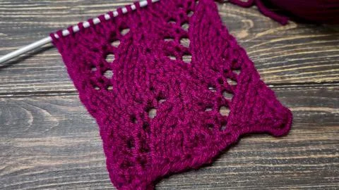 Knitting patterns with a raised pattern and yarn in different colors. Copy .. 스톡 사진