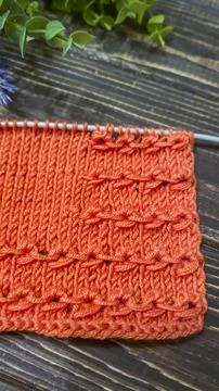 Knitting patterns with a raised pattern and yarn in different colors. Copy .. 스톡 사진