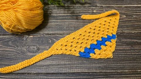 Knitting patterns with a relief pattern and yarn in different colors. Clothin Stock Photos