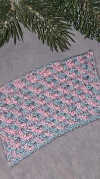Knitting patterns for sweaters, hats, and other items using light-colored yar Fotos de archivo